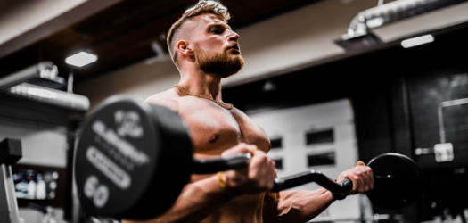 Guy lifting weight at GymFit Mascot