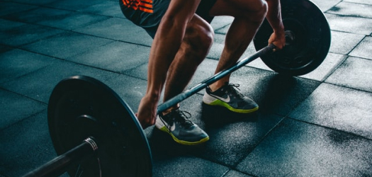 Man lifting weight at GymFit Neutral Bay